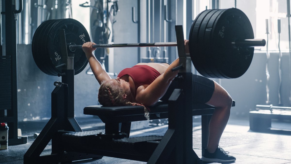 Barbend-Featured-Image-1200x675-A-person-doing-bench-press-exercises